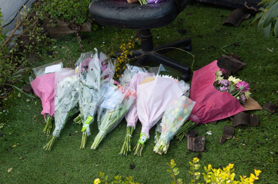 Flowers at the scene of the fatal fire