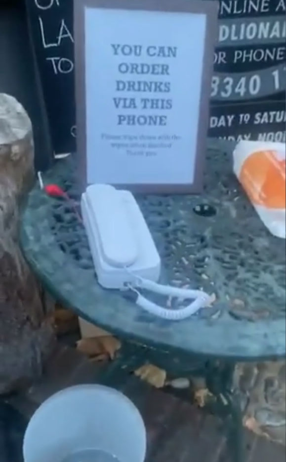 The pub landlord put a phone outside so that boozers can 'pre-order' and collect their pint straight away