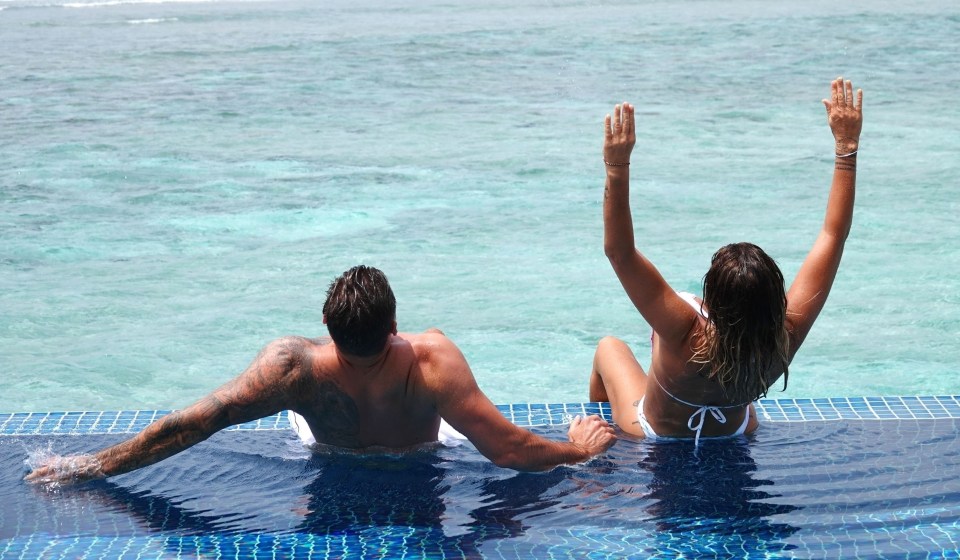 The couple larked about in the stunning ocean-side pool