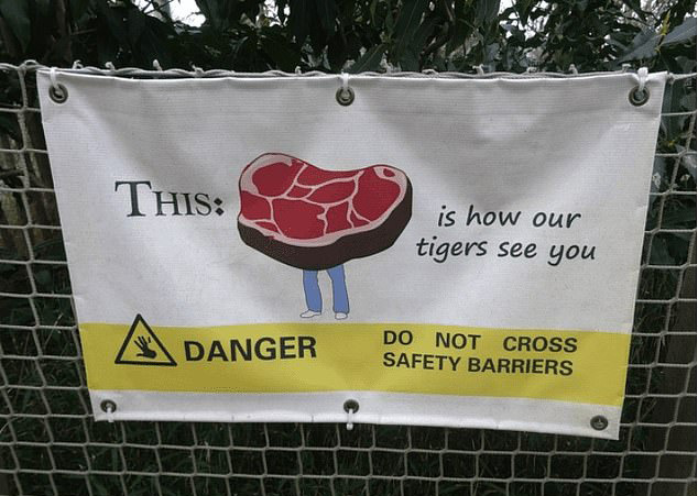 That’s one way to make a point – this sign might be brutally honest, but it definitely hammers home not to cross the safety barriers into the tiger enclosure