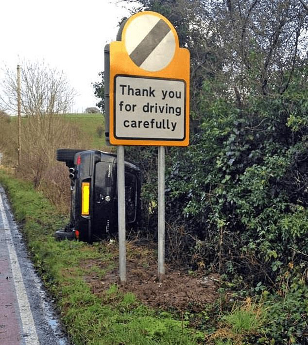 This driver must have just missed this sign thanking them for driving carefully, because they rolled off the road into the grass verge right after it