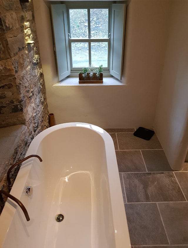 The house has a freestanding bath in the bathroom