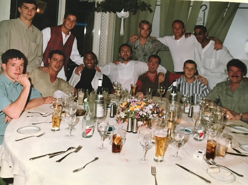 Robbie, top centre, pictured in Marbella with pals