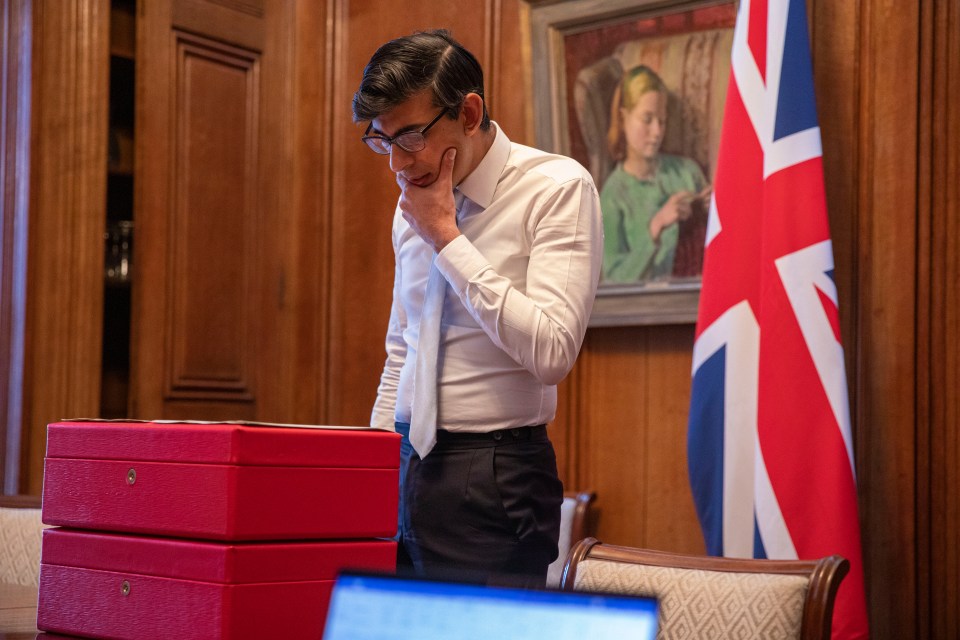 The chancellor putting the final touches on the spending review last night