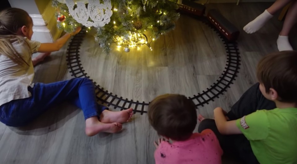 A second tree in the kitchen is surrounded by a Hogwarts Express train