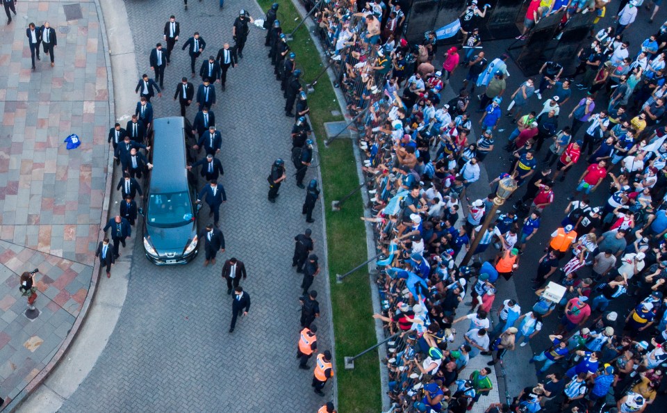 The hearse carrying the casket of Diego Maradona leaves the government house