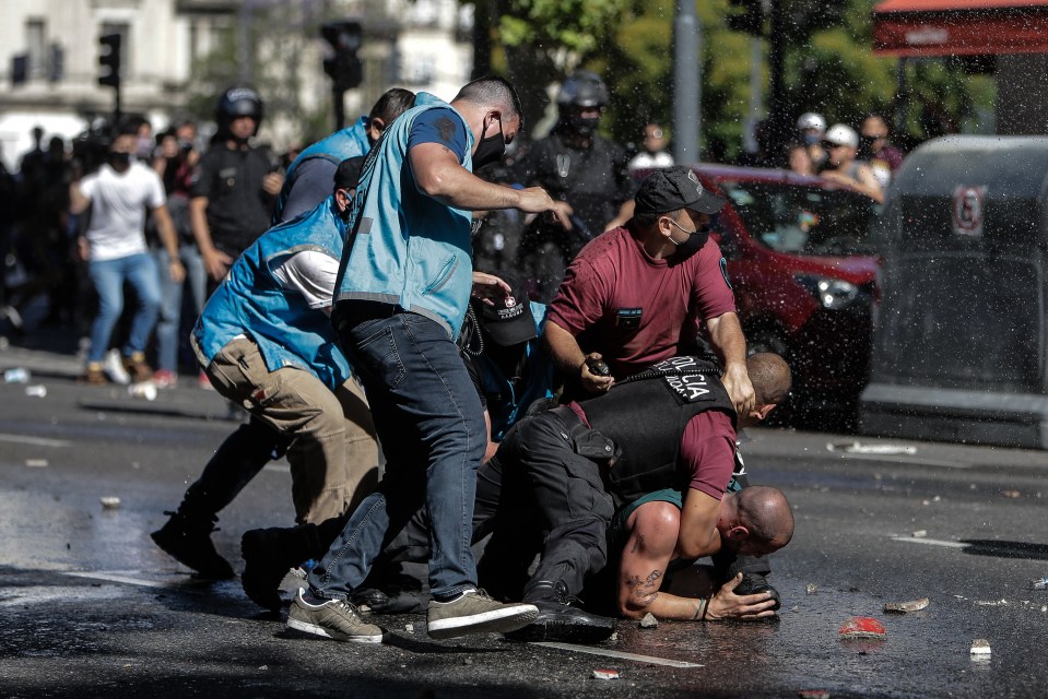 Grief and passion boiled over as officials had to step in and restrain some mourners