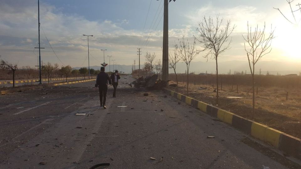 Debris is seen after the reported car bomb at the roadside