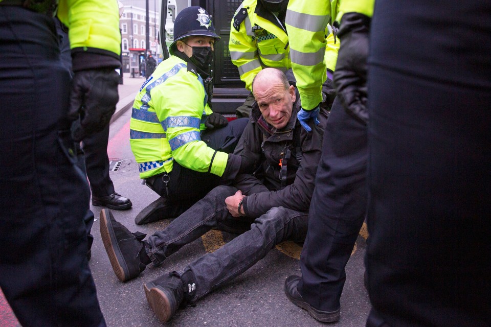 Police move in and arrest a man at the anti lockdown protest ‘Our Movement’ demonstration outside London’s Kings Cross Station 