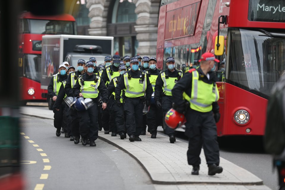 Police reinforcements come in near Regent Street during anti-lockdown protests