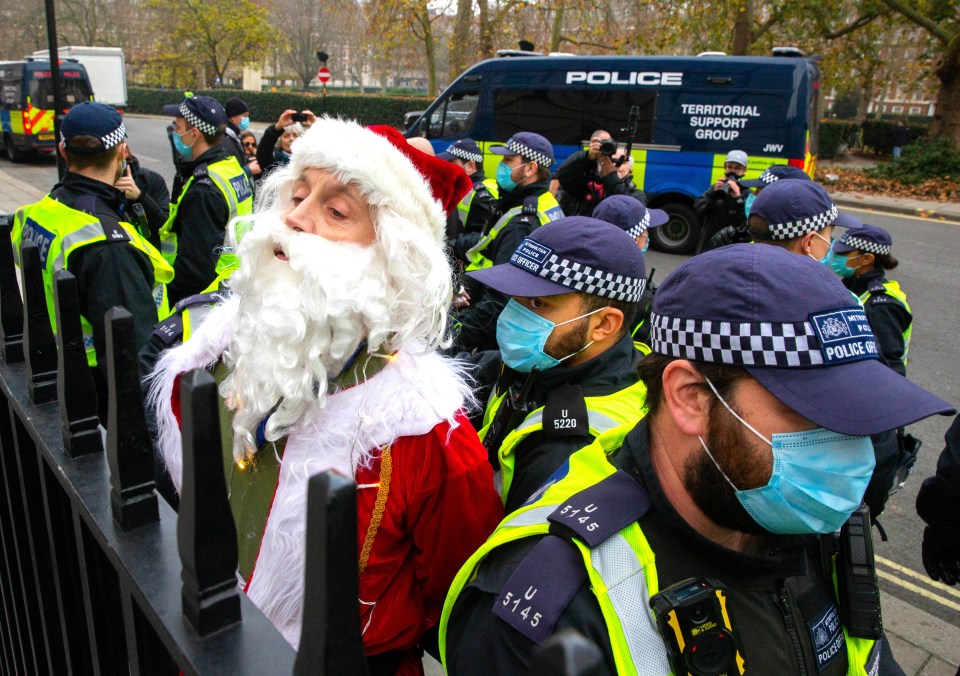 A man dressed as Santa was arrested by police during demonstrations