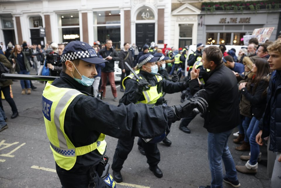 Police and anti-lockdown protesters clash in central London