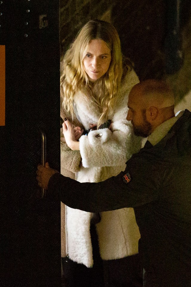 Poppy Delevingne arrived in a fur coat while clutching a bottle