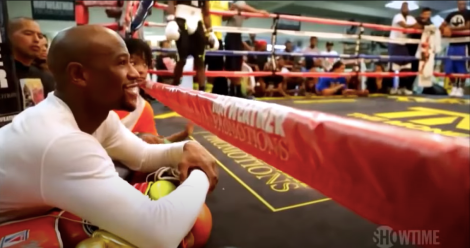 Mayweather watches on the sparring in his Las Vegas gym 