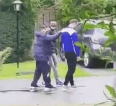 He can be seen holding on to the two men as he struggled to walk