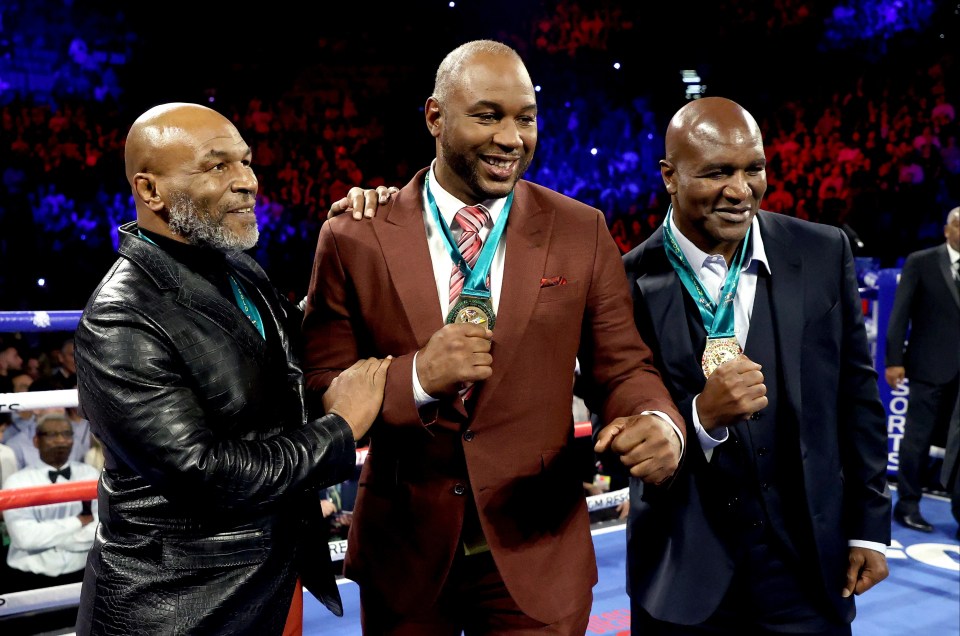 Tyson pictured with Lewis and Evander Holyfield