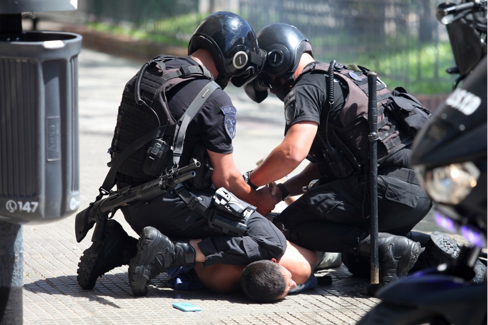 Riot cops pinned one man to the ground