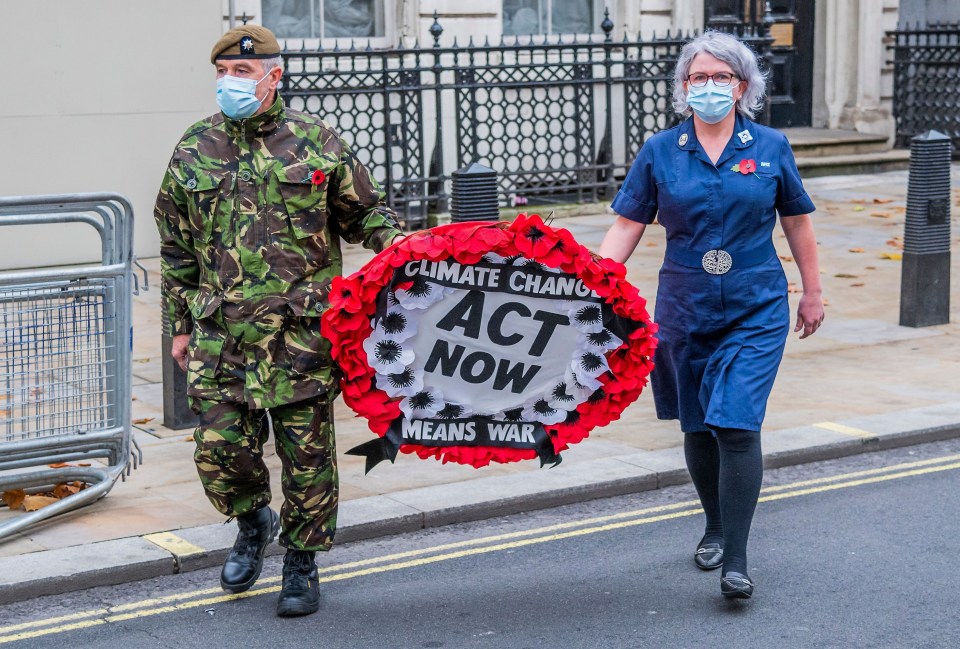 The pair carried a wreath towards the Cenotaph this morning