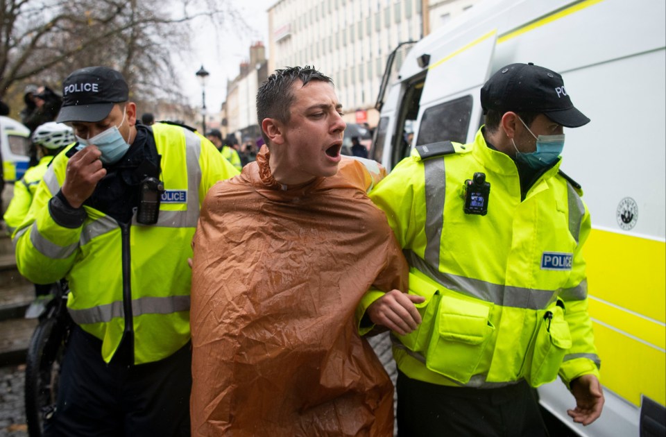 Cops detain a man in a costume 