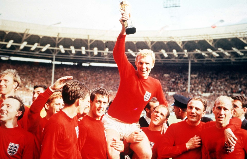 Sir Bobby is pictured here on the far right as Bobby Moore holds aloft the World Cup for England in 1966