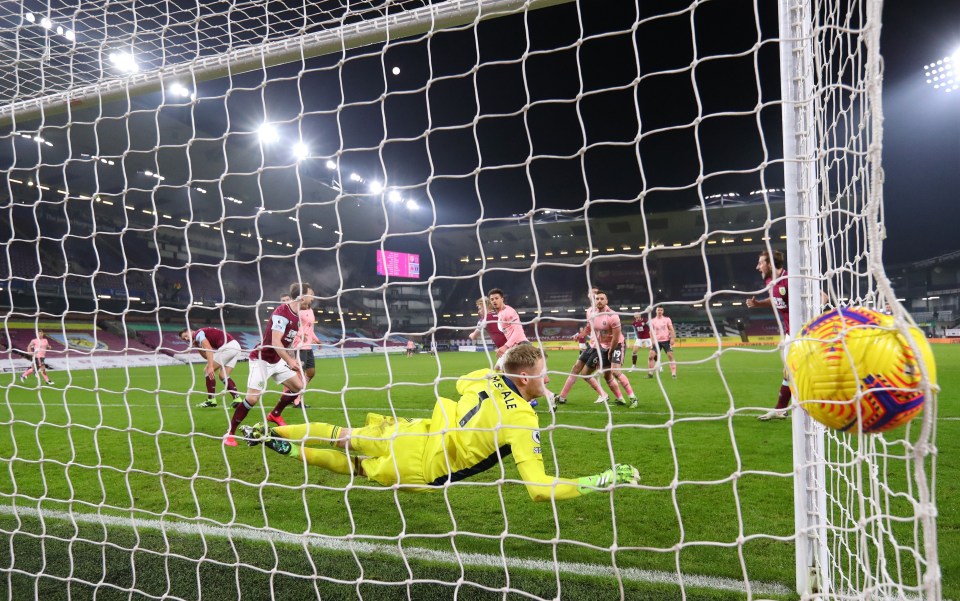 Aaron Ramsdale barely has time to look back as Ben Mee's header beats him