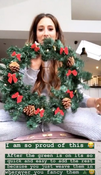 Stacey has decided on a very traditional wreath, boasting bows, pine cones and gorgeous winter green foliage