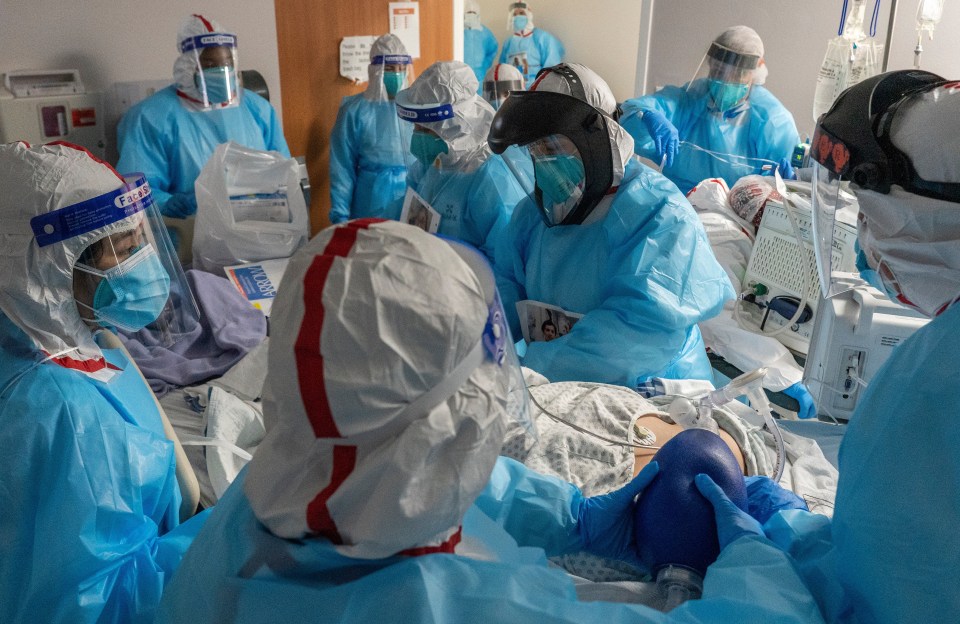 Doctors treating a coronavirus patient in an intensive care unit in Texas