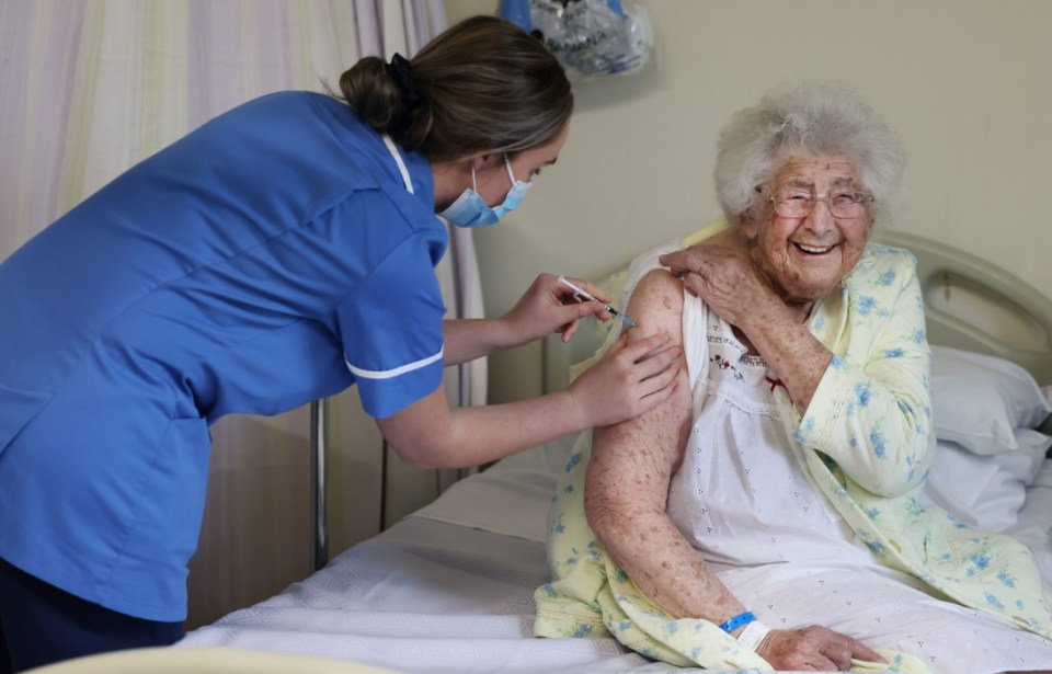 Ethel Jean Murdoch, 95, receiving her coronavirus vaccine at Aintree University Hospital in Liverpool