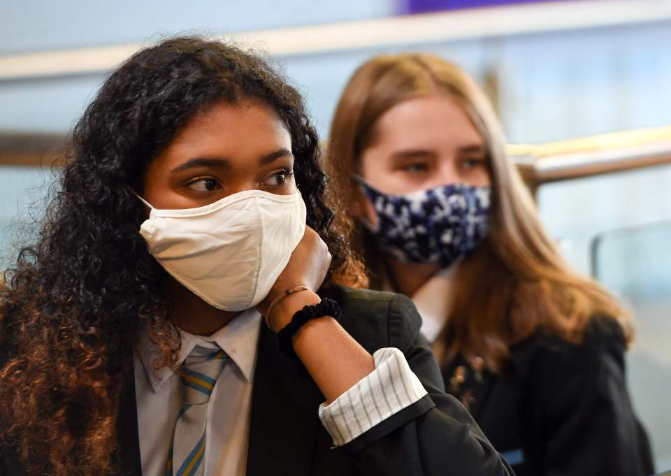 Pupils wear face masks as they sit in class at Springburn Academy school in Glasgow on August 31