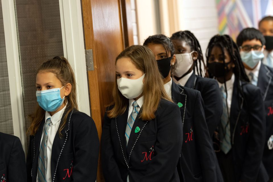 The new coronavirus strain may have infected more children than other variations of the virus, experts have warned. Pictured: Pupils at Moor End Academy in Huddersfield, September 11