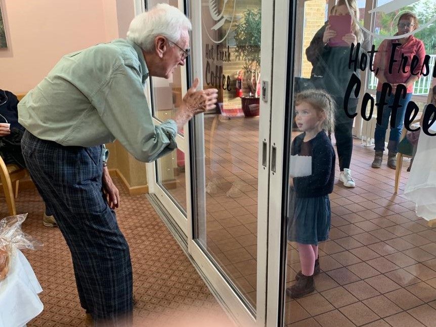 Gerry and Maeve are delighted to see each other through the glass