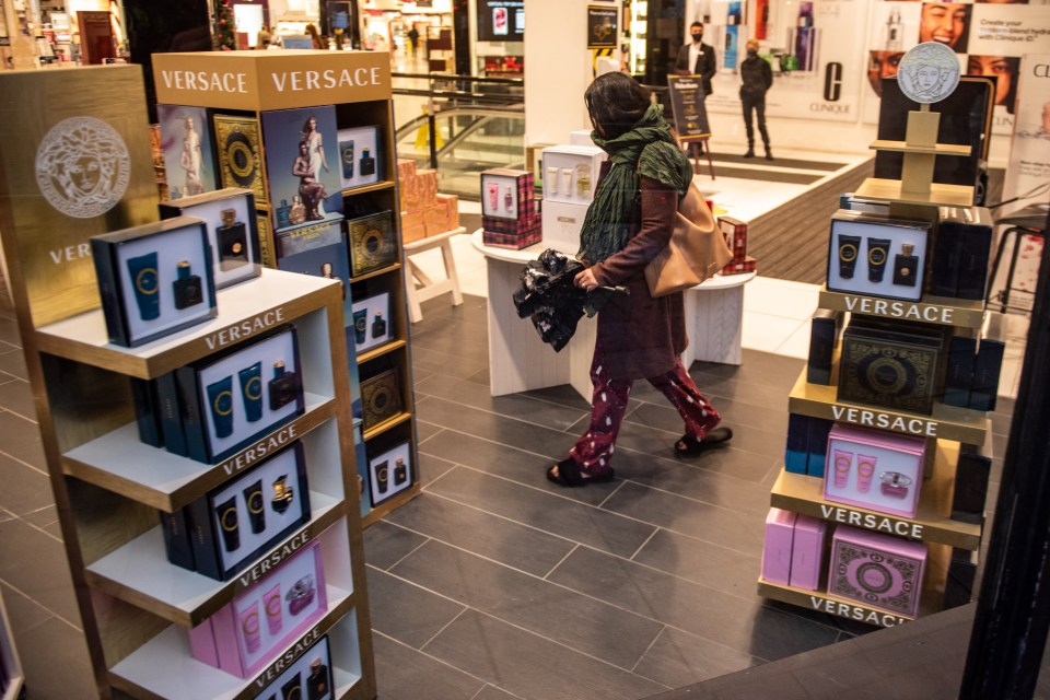 Customers shop in Debenhams in Manchester city centre this morning