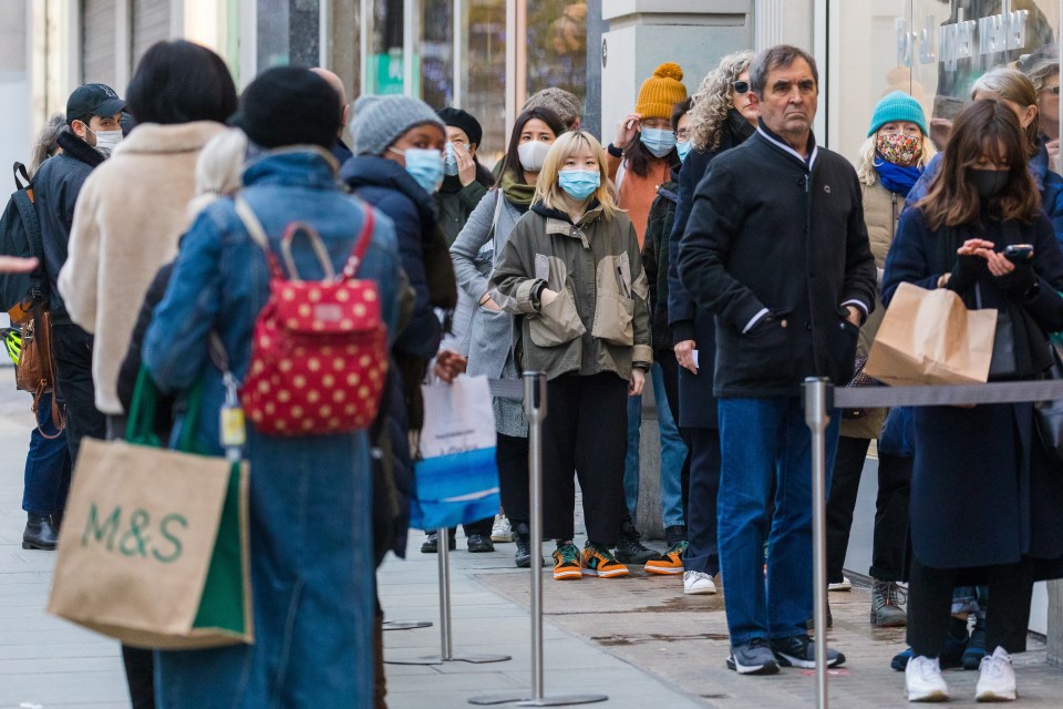 Shoppers braved the December chill and queued for stores 