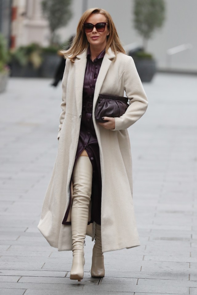 Amanda Holden wowed in knee-high leather boots and a purple dress in London