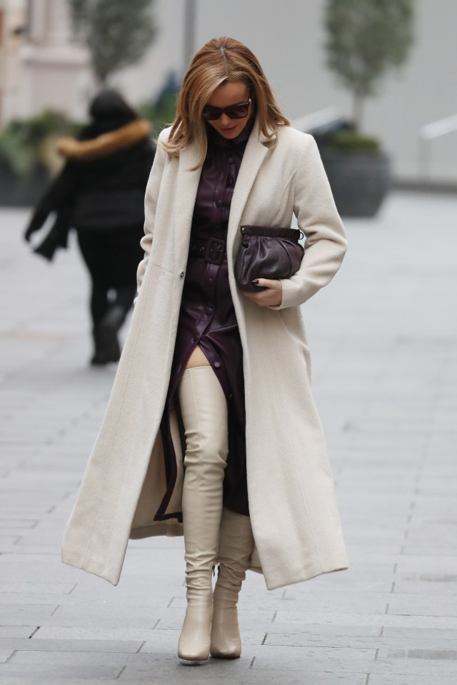 Amanda admires her gorgeous boots as she leaves work