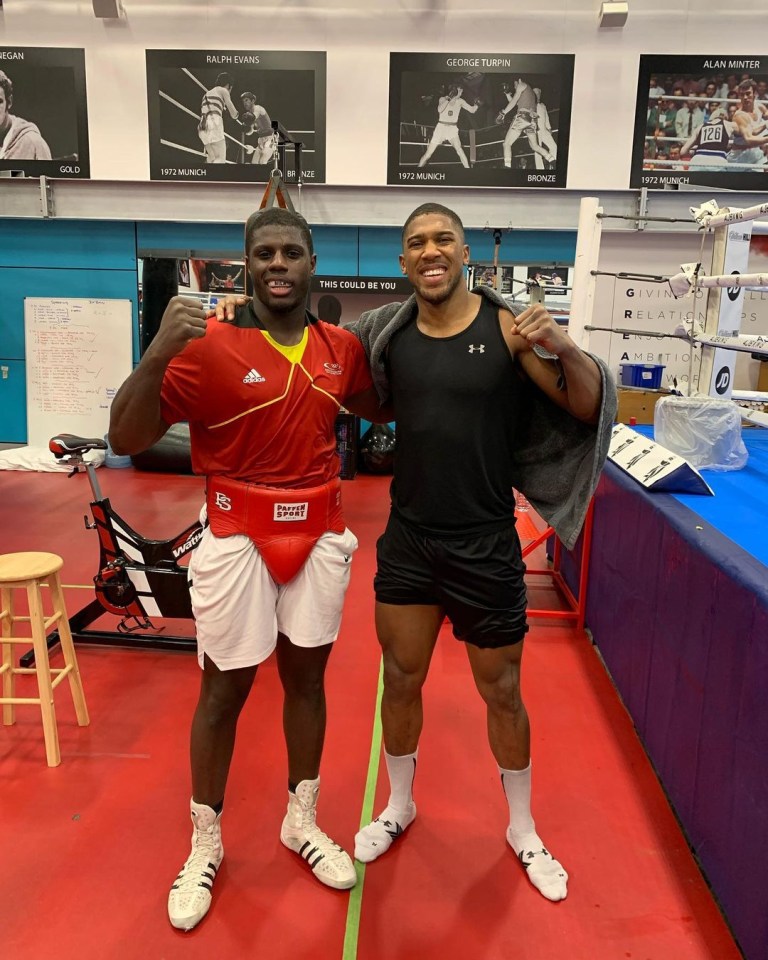 Joshua pictured with his sparring partner Peter Kadiru