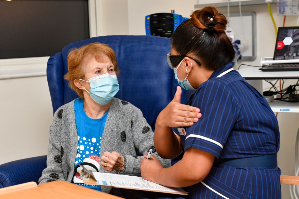 Nurse May explains the process before administering the jab to Maggie