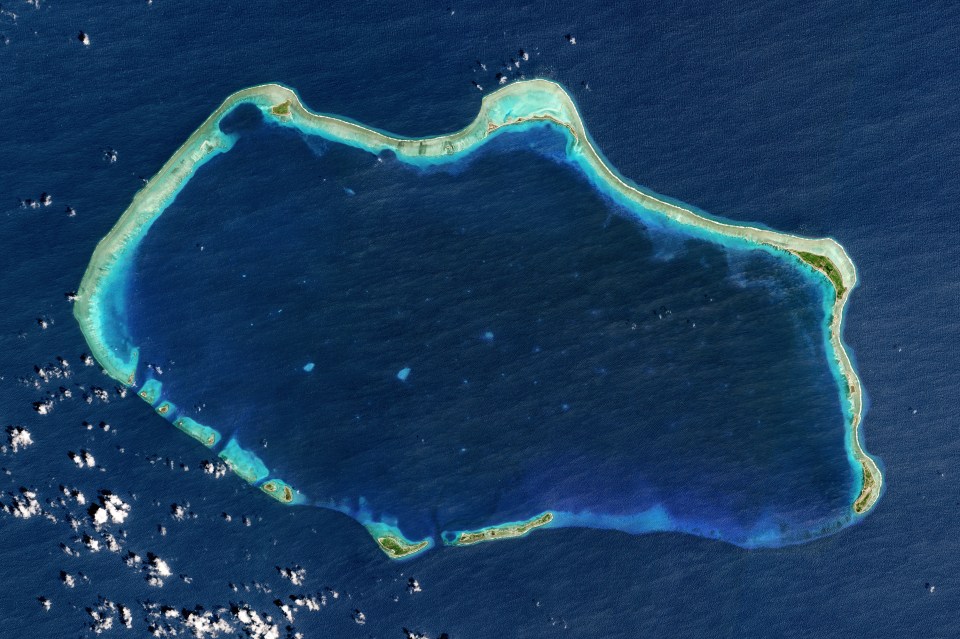 an aerial view of a large island in the middle of the ocean