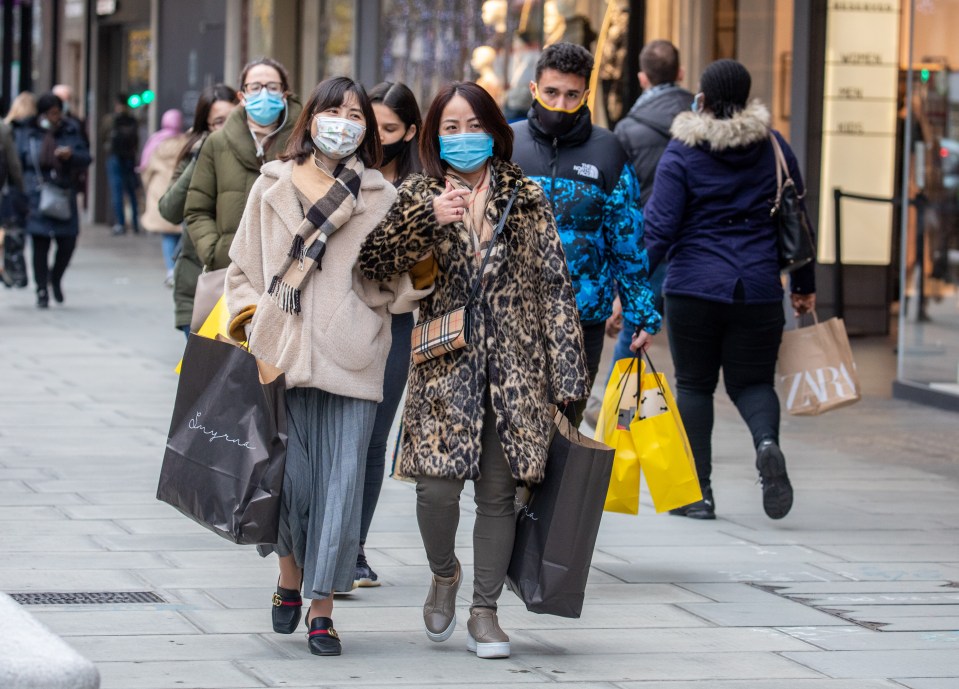 People wearing face masks in London as they shop on Oxford Street