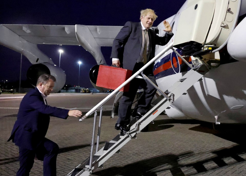 Boris gives a wave as he boards his plane taking him to Brussels