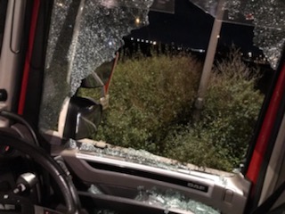 Migrants smashed his cab window and tried to storm inside