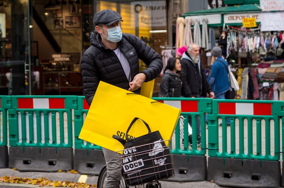 A shopper gets in his bike after popping into Selfridges