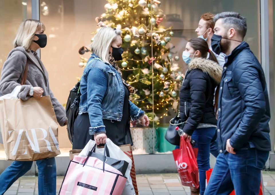 Shoppers in Leeds, West Yorkshire, today