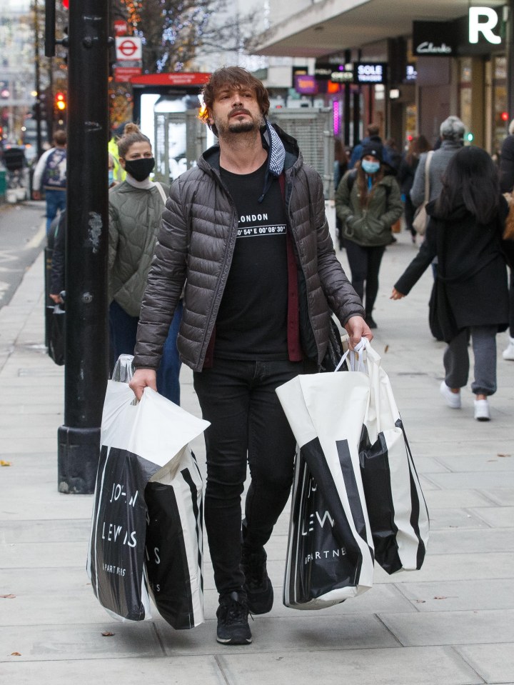  A shopper laden with bags in London's Oxford Street today