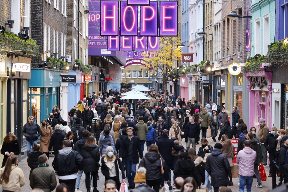 London's West End today as pandemic-weary Brits indulged in some retail therapy