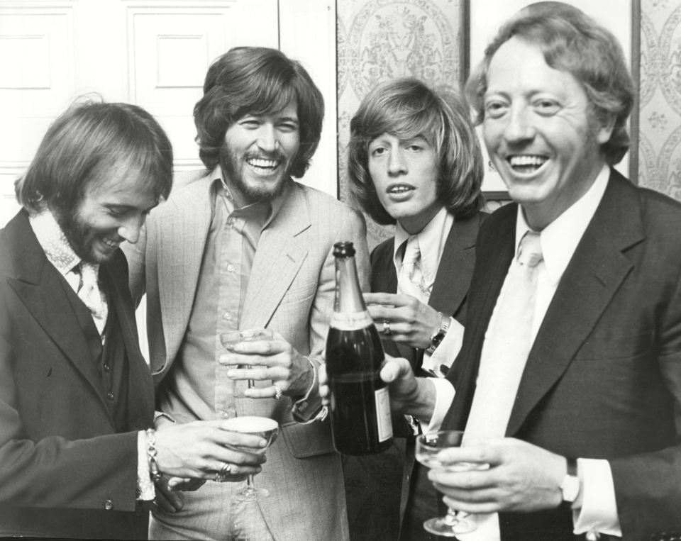 Maurice, Barry and Robin Gibb with their manager Robert Stigwood