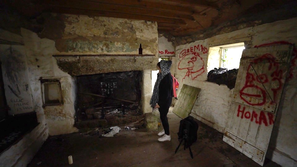 The property has been abandoned and covered in graffiti