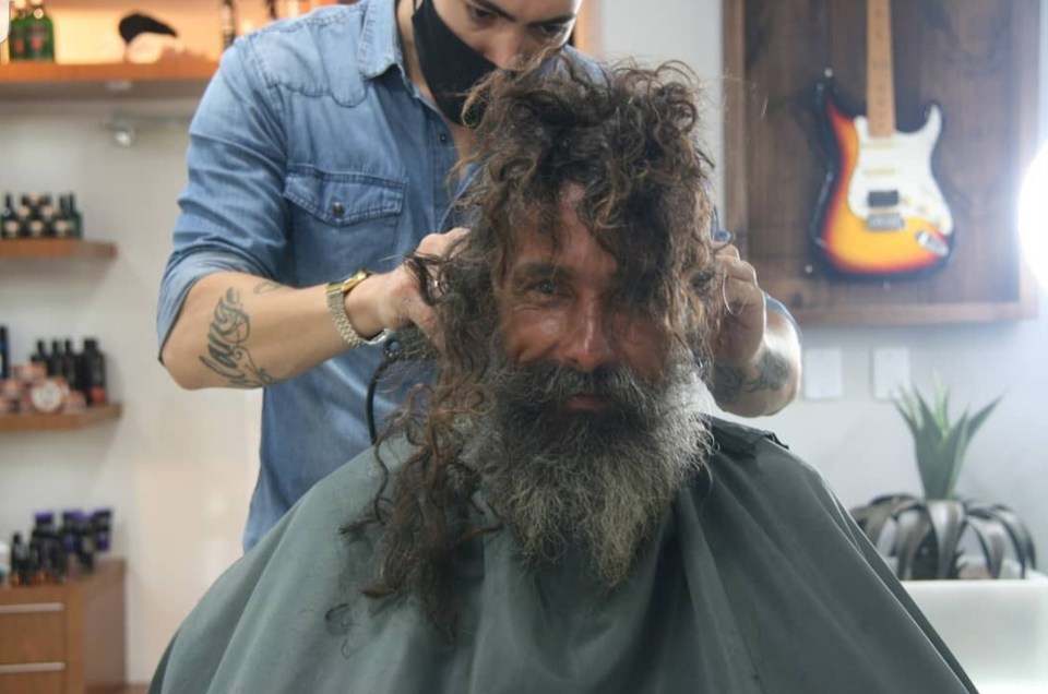 He entered with long, dishevelled hair and a beard in need of a trim