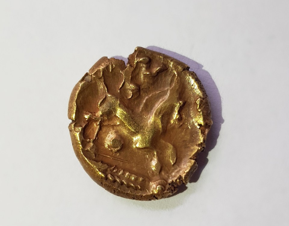 A Celtic gold coin as part of a hoard found in east England