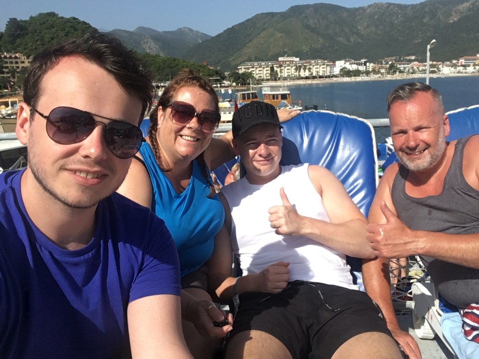 Peter is pictured above with his Mum, Dad and brother on their last family holiday 